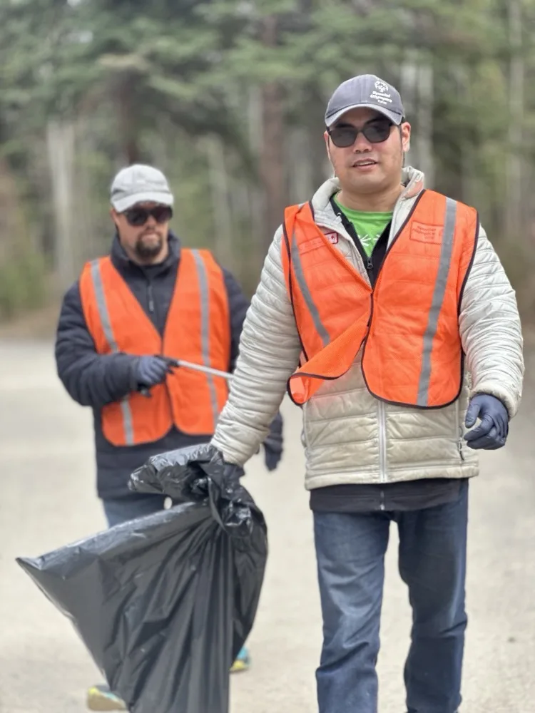 Ernest and Stefan volunteering during a local garbage cleanup, 2024
