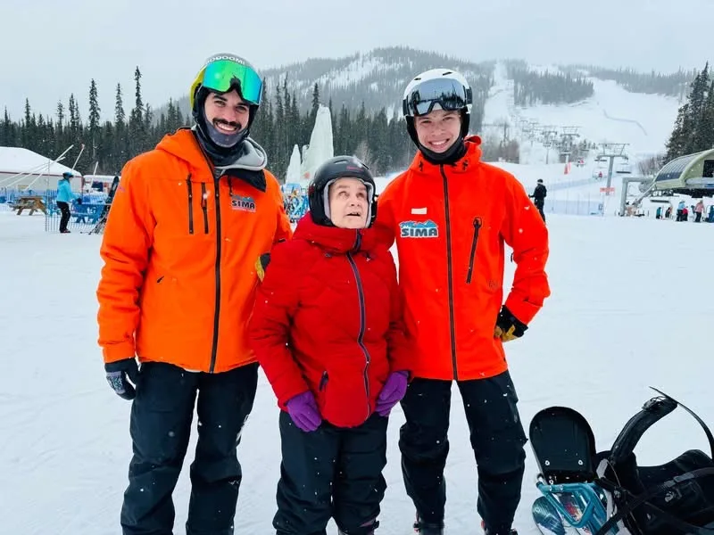 Hayley with two ski instructors at the Mt Sima ski hill, 2025